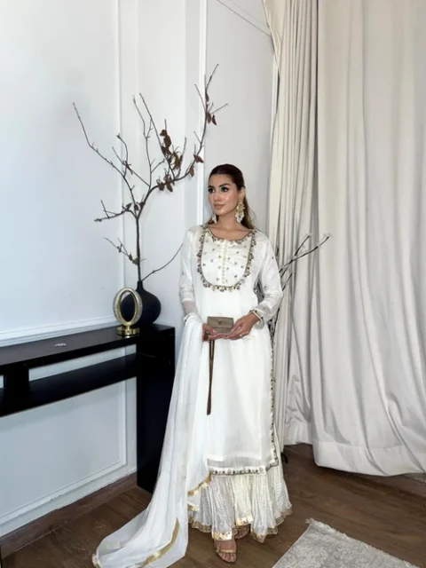 ```text Nur | Elegant White Chiffon 3 Piece Festive Sharara Suit ```